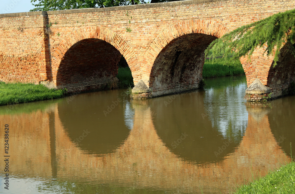 Fototapeta premium ancient arched bridge made of red bricks
