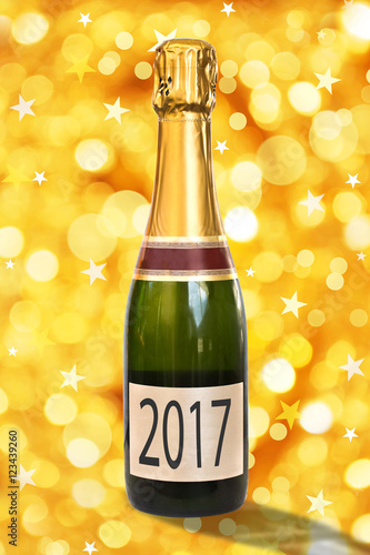 2017 on a label of a bottle of Champagne, shiny golden background, 2017 new year concept