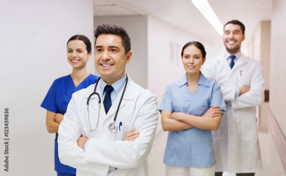 group of happy medics or doctors at hospital group of happy medics or doctors at hospital
