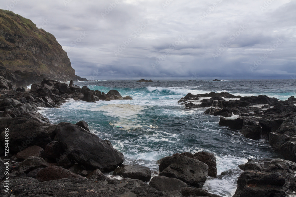 Ocean Waves in Natural Pool of Termas da Ferraria, Azores, Portugal Ocean Waves in Natural Pool of Termas da Ferraria, Azores, Portugal