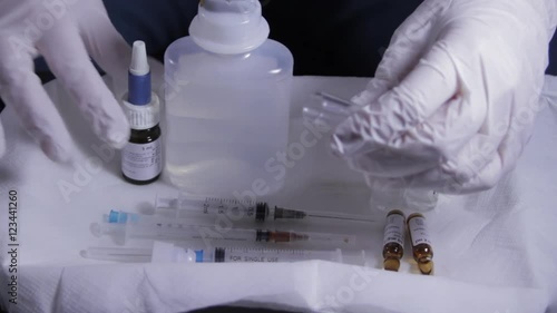 Doctor's Hands Adding A Reagent To A Test Tube, Laboratory, Research, Clinic