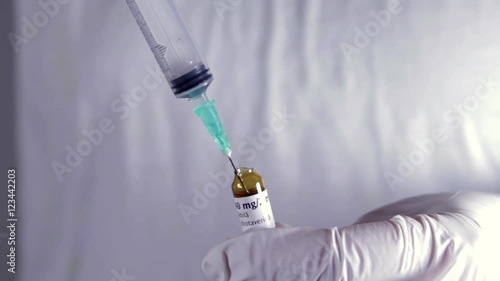 Nurse Hands Preparing Syringe With Medicine, Vial and Syringe Detail, Hospital