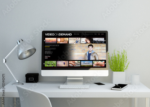 modern clean workspace with video on demand website on screen