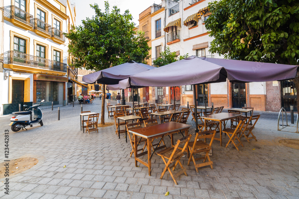 Street cafe of one of the central districts of Seville, Andalusia province, Spain.