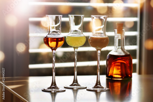 Photography Whisky and liqueur in front of a window