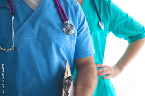 Close-up of unknown female doctor with stethoscope isolated