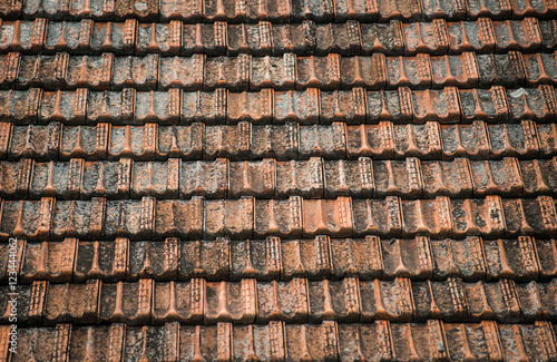 Texture of old weathered red roof tiles. 