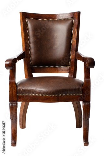 Luxurious brown vintage wooden armchair upholstered in leather isolated on white background