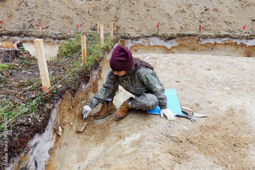 Archaeology - cleaning wall excavations