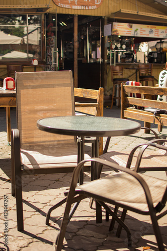 table and chairs in a street cafe