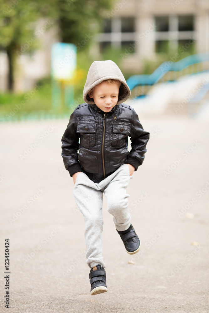 Kid jumping and having fun outdoors Kid jumping and having fun outdoors