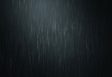 the rain water drop falling in rainy season with dark color as abstract background
