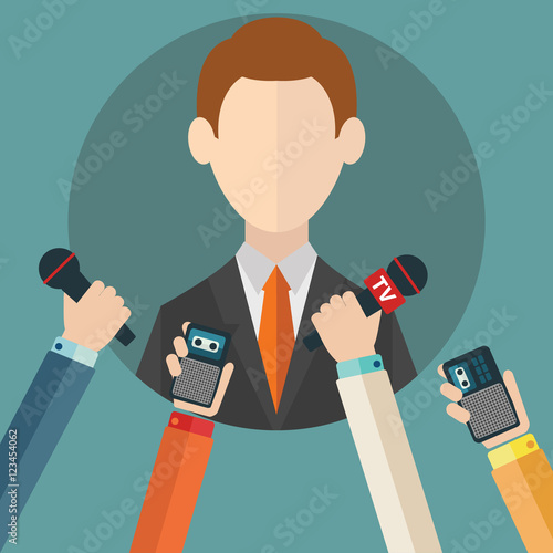 Businessman giving an interview in the presence of journalists with microphones