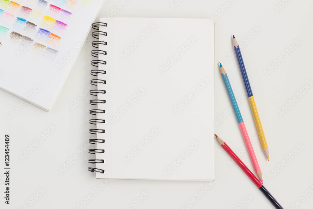 Top view of art supplies on white table. Top view of art supplies on white table.