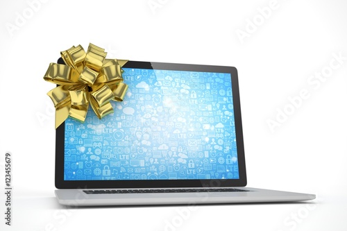 Tied laptop with golden bow on white background. Modern present or gift for birthday  holiday  christmas. 3D rendering.