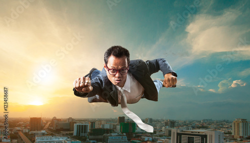 Wallpaper Mural business man flying over skyscraper for business successful and Torontodigital.ca