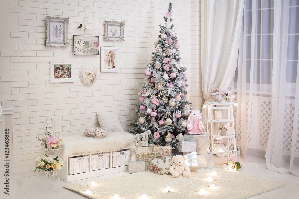 Christmas room in shabby chic style. Decorated New Year tree with gift  boxes under it near evening window. Stock-Foto | Adobe Stock