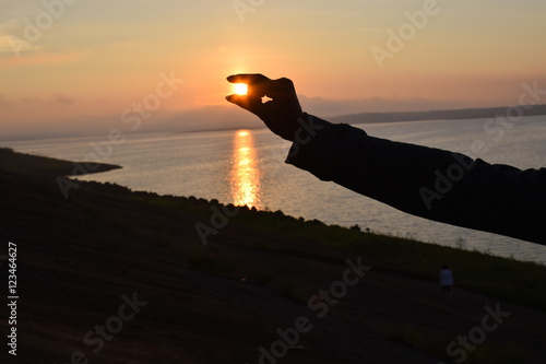 hand capture the sun