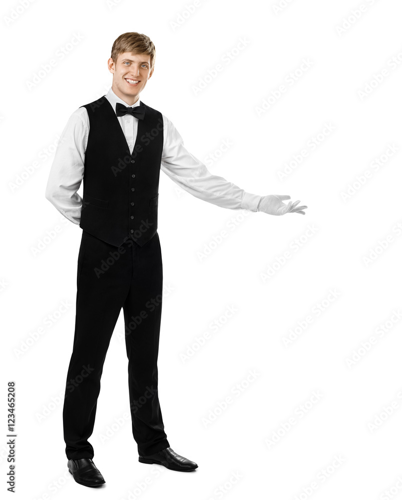 Young handsome waiter doing a welcome gesture