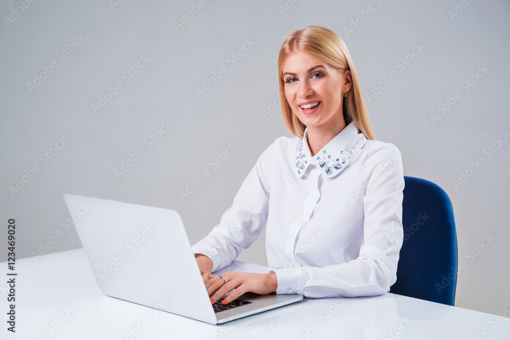 Young businesswoman working at laptop computer Young businesswoman working at laptop computer