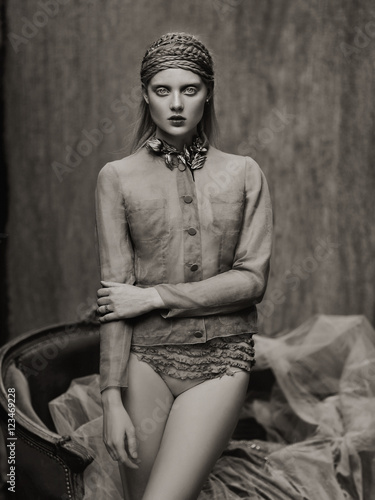 Woman wearing blouse and panties
