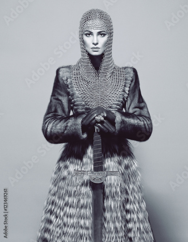 Woman posing in battle armour, studio shot, black and white  (ID: 123469261)