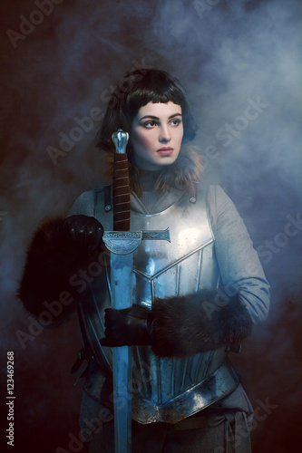 Woman posing in battle armour, studio shot  (ID: 123469268)