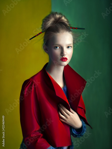 Portrait of blonde woman wearing red jacket  (ID: 123469449)