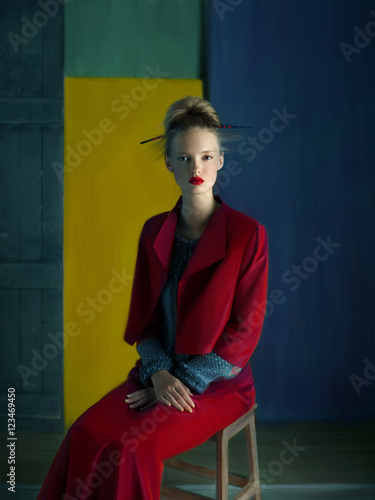 Blonde woman wearing red jacket and long skirt  (ID: 123469450)