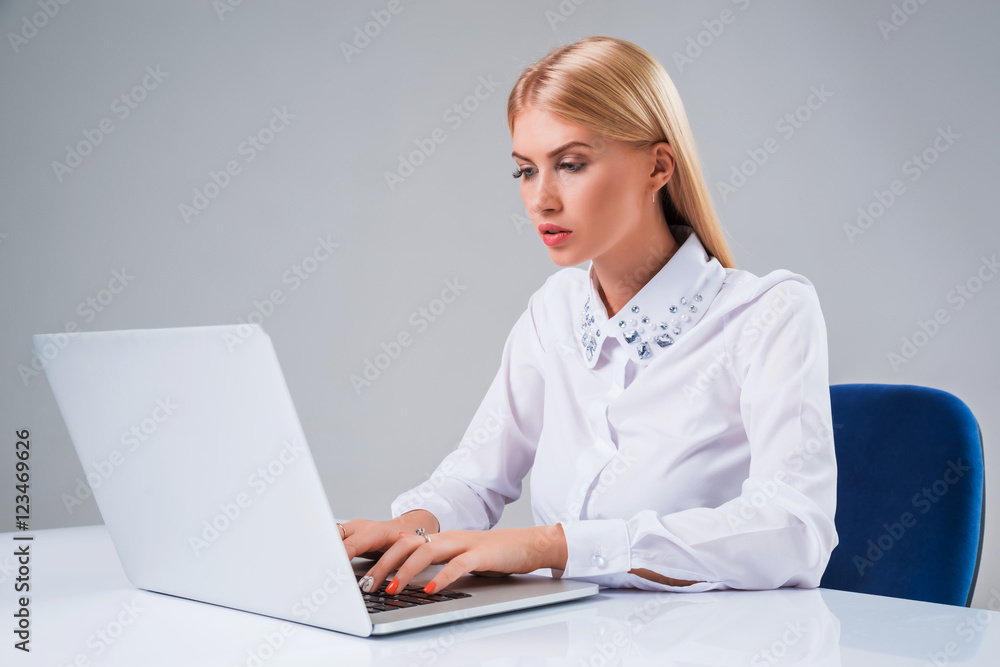 Young businesswoman working at laptop computer Young businesswoman working at laptop computer