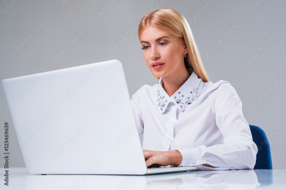 Young businesswoman working at laptop computer Young businesswoman working at laptop computer