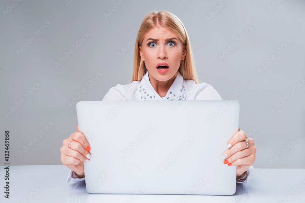 Fototapeta premium Young businesswoman working at laptop computer