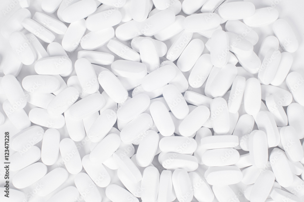 White pills on the white background. White pills on the white background.