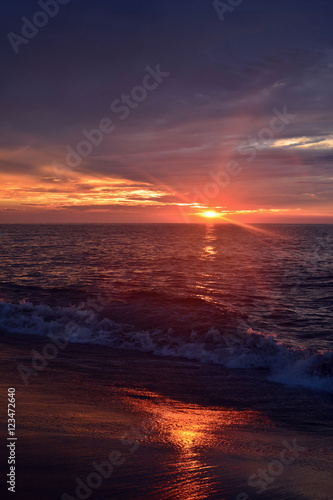 Glowing Sunrise at the Beach Over the Ocean