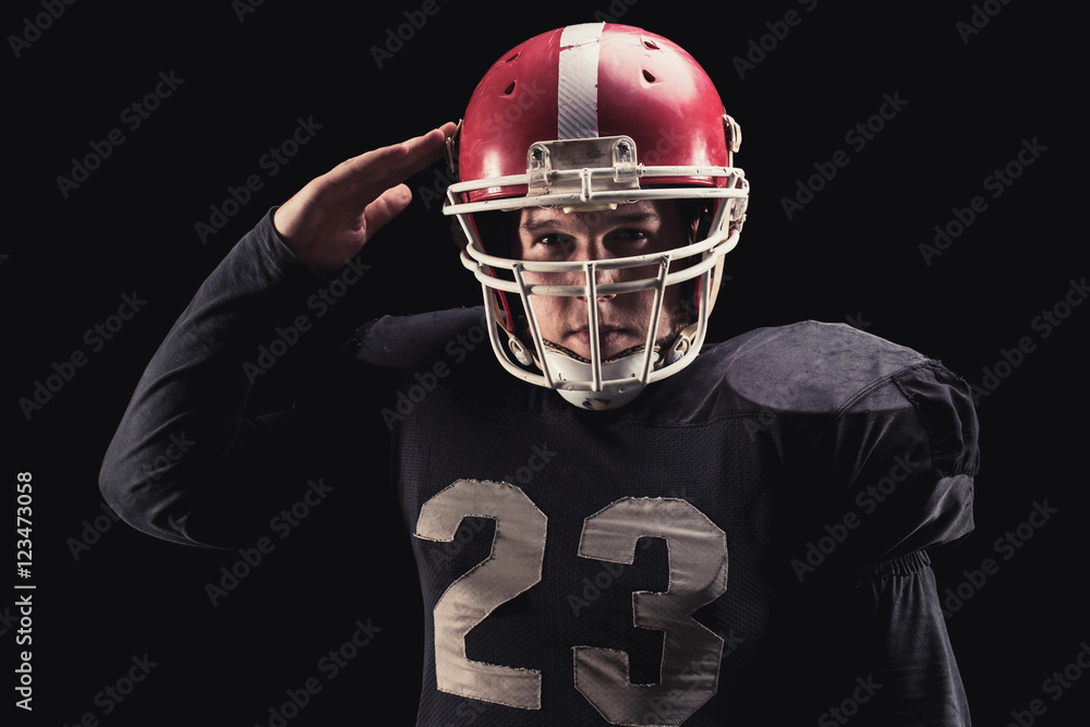 Football player on dark background