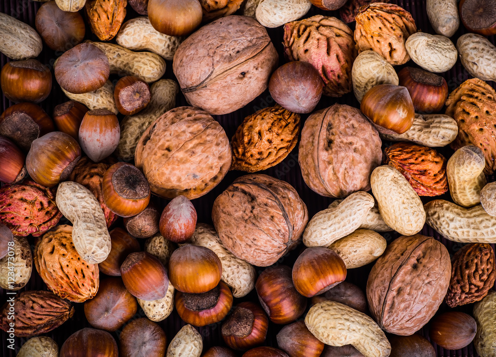 Nuts mix in a wooden plate Nuts mix in a wooden plate