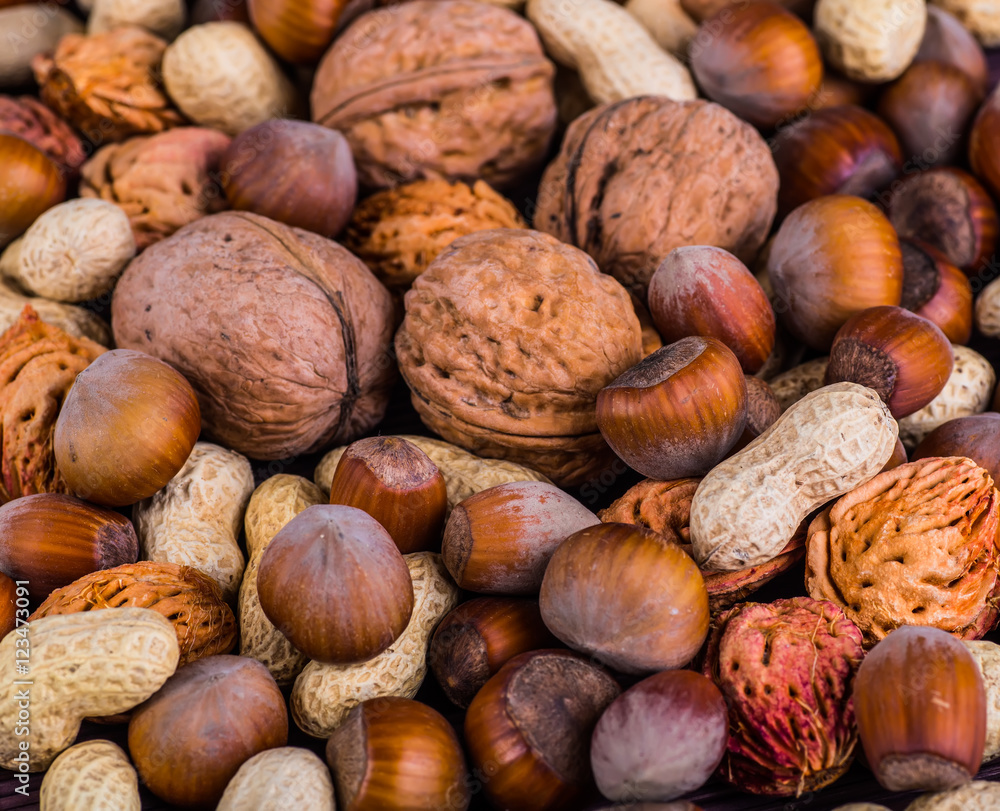 Nuts mix in a wooden plate Nuts mix in a wooden plate