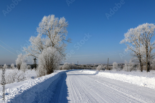 Road in snow in cold winter day