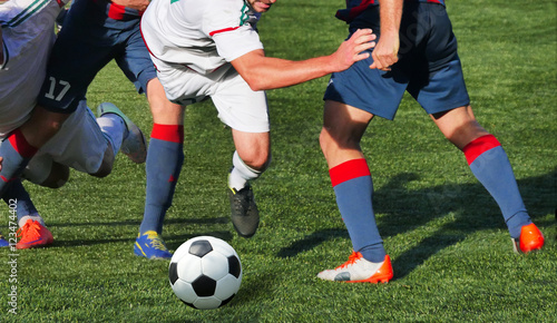 Soccer player legs in action © Vitaly Krivosheev