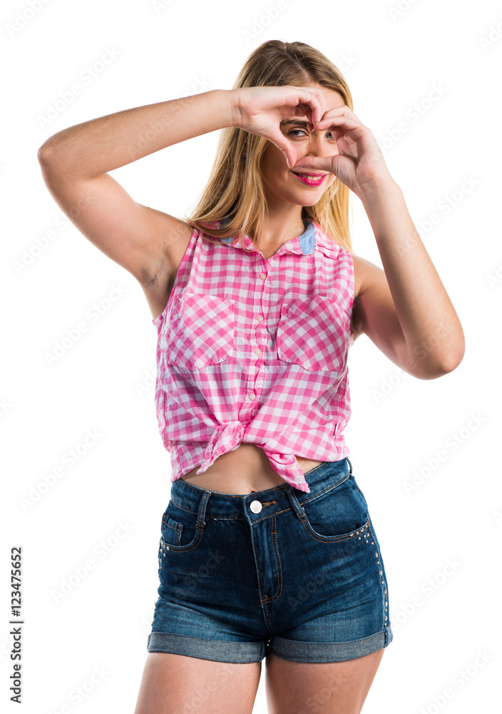 Girl making a heart with her hands Girl making a heart with her hands