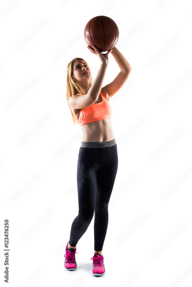 Blonde girl playing basketball