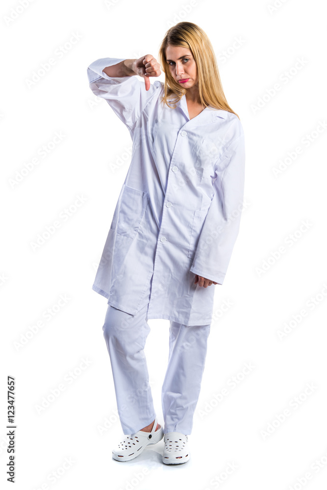 Doctor woman doing bad signal