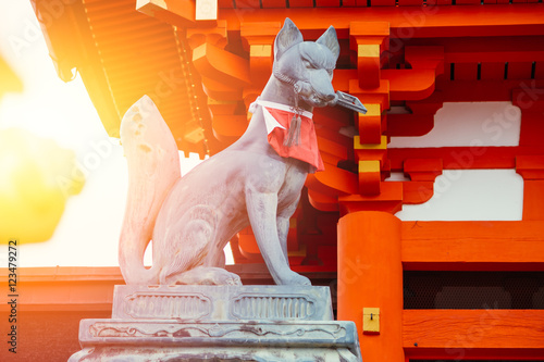 Fox stone statue at Fushimi Inari Shrine (Fushimi Inari Taisha) temple in Japan