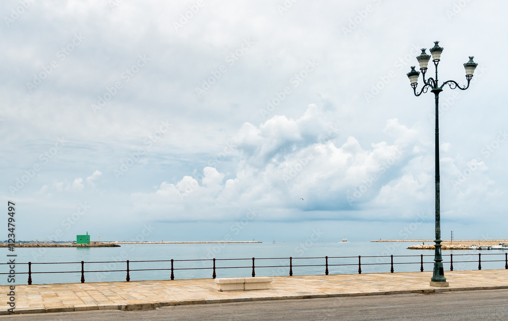 Seascape in cloudy weather with side street lamp. Meditation concept. Postcard or background. Seascape in cloudy weather with side street lamp. Meditation concept. Postcard or background.