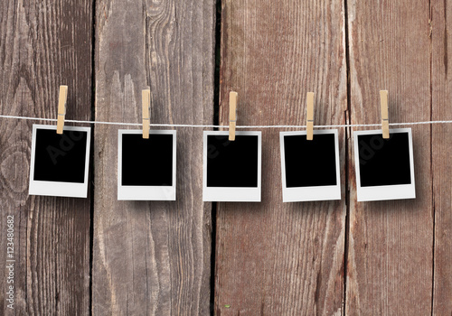 Canvastavla Blank photo frames, polaroids hanging on a cord