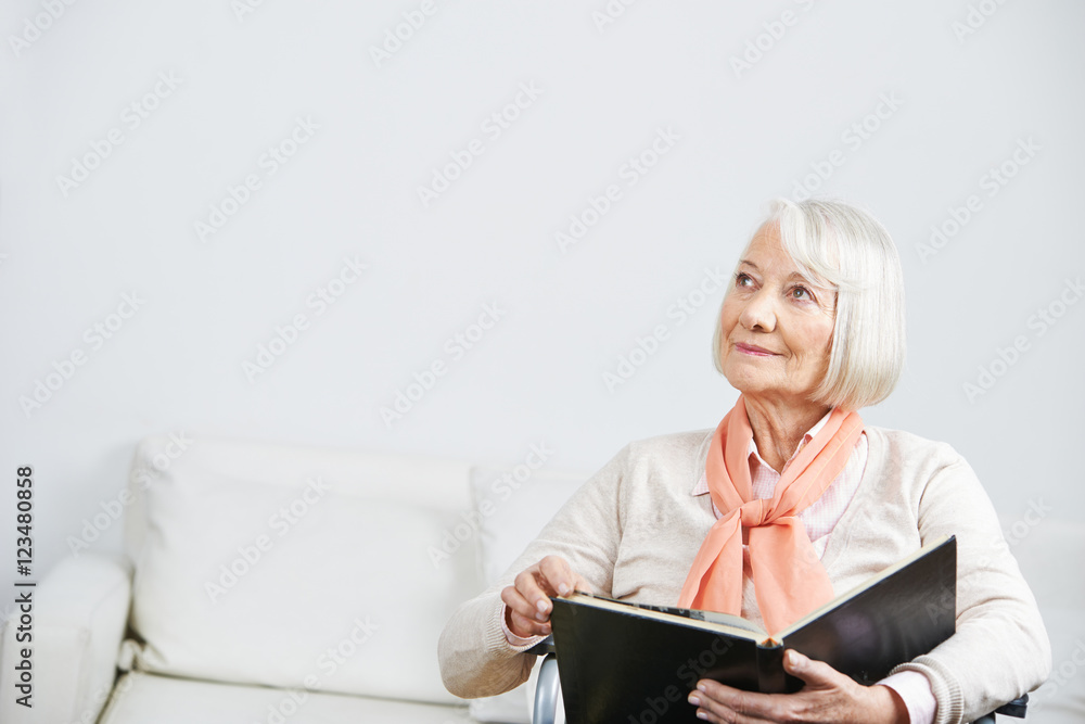 Senior woman with book looking pensive Senior woman with book looking pensive