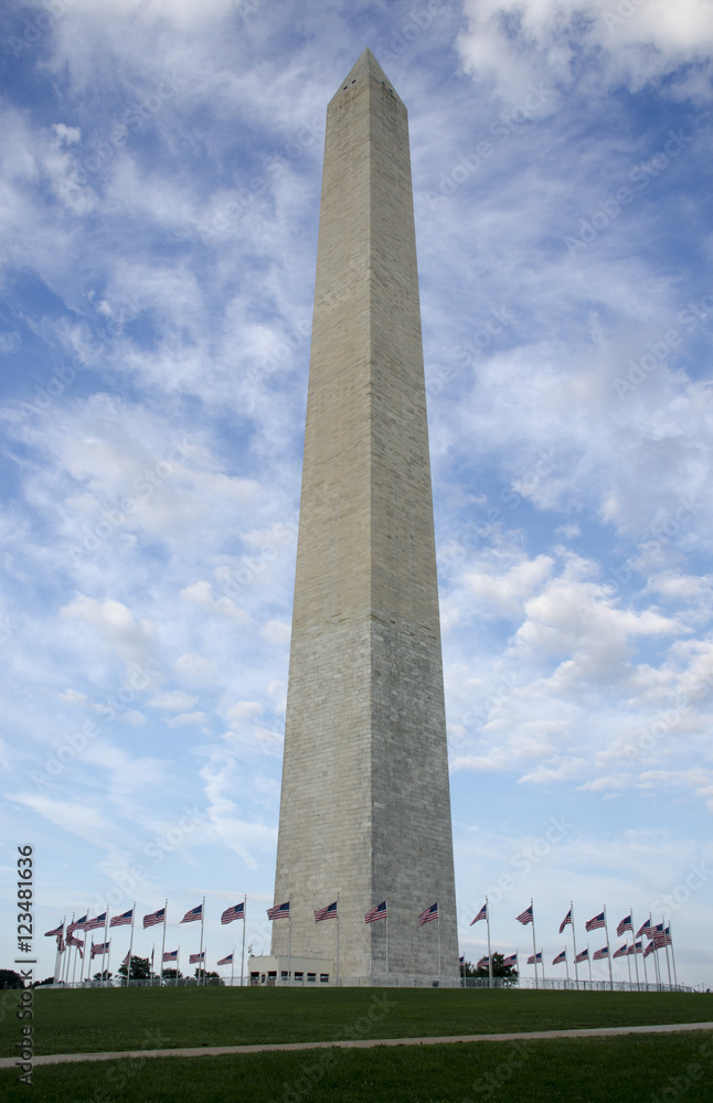 Washington Monument encircled by fifty waving flags on a windy day