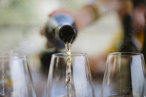 White wine being poured into glasses, Cinque Terre, Italy, Europe