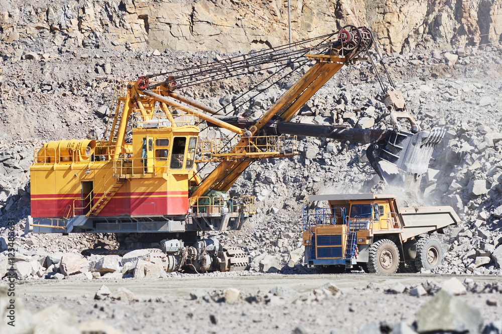 excavator loading granite or ore into dump truck at opencast excavator loading granite or ore into dump truck at opencast