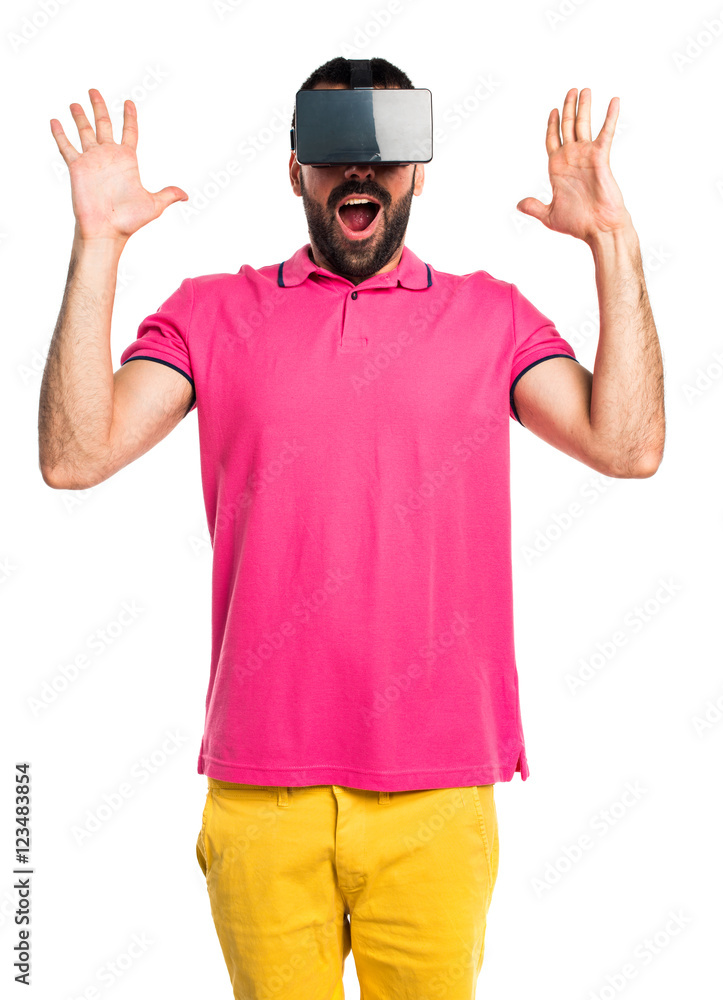 Man with colorful clothes using VR glasses Man with colorful clothes using VR glasses